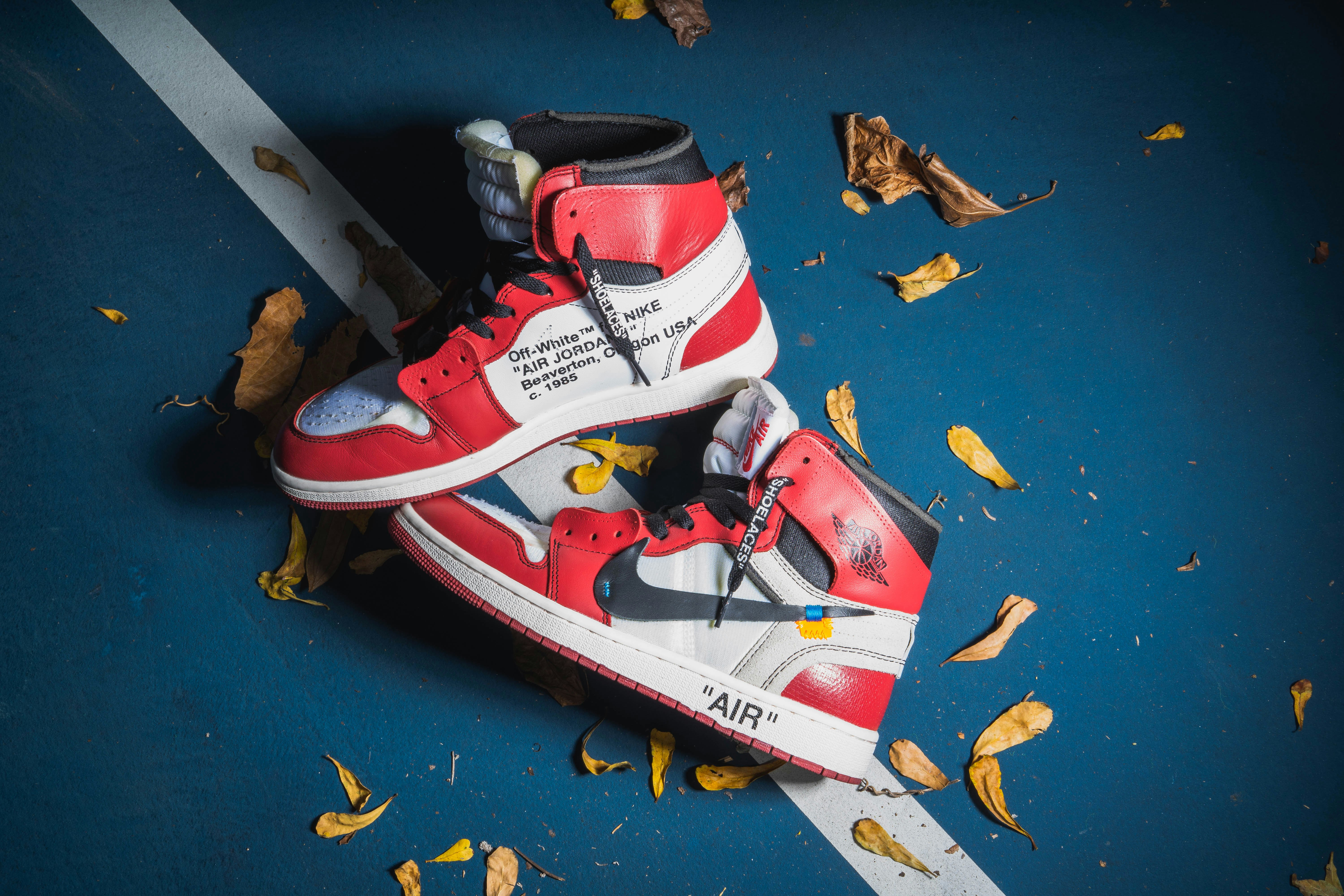 red-and-white Nike Air Jordan 1's